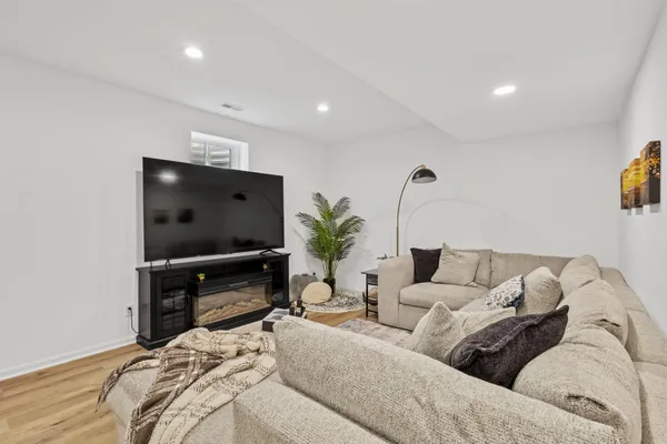 an aerial view of a house with a garden and lake view