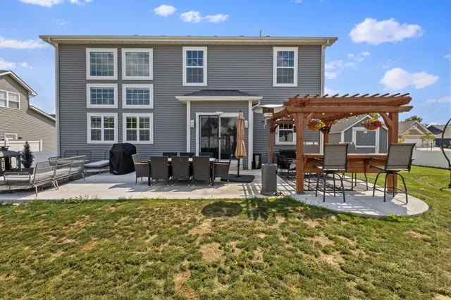 an aerial view of a house with a swimming pool yard and outdoor seating