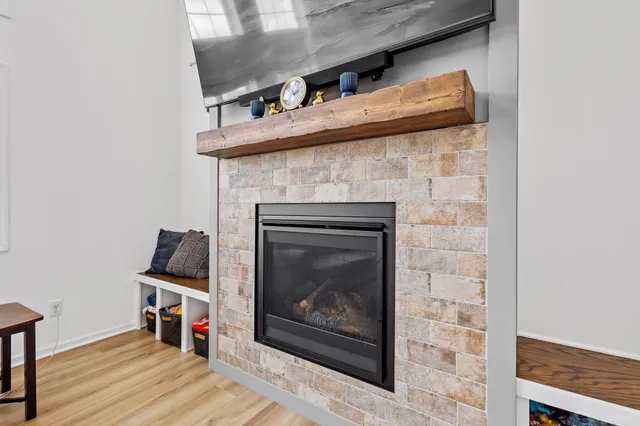 a kitchen with a dining table chairs sink and cabinets