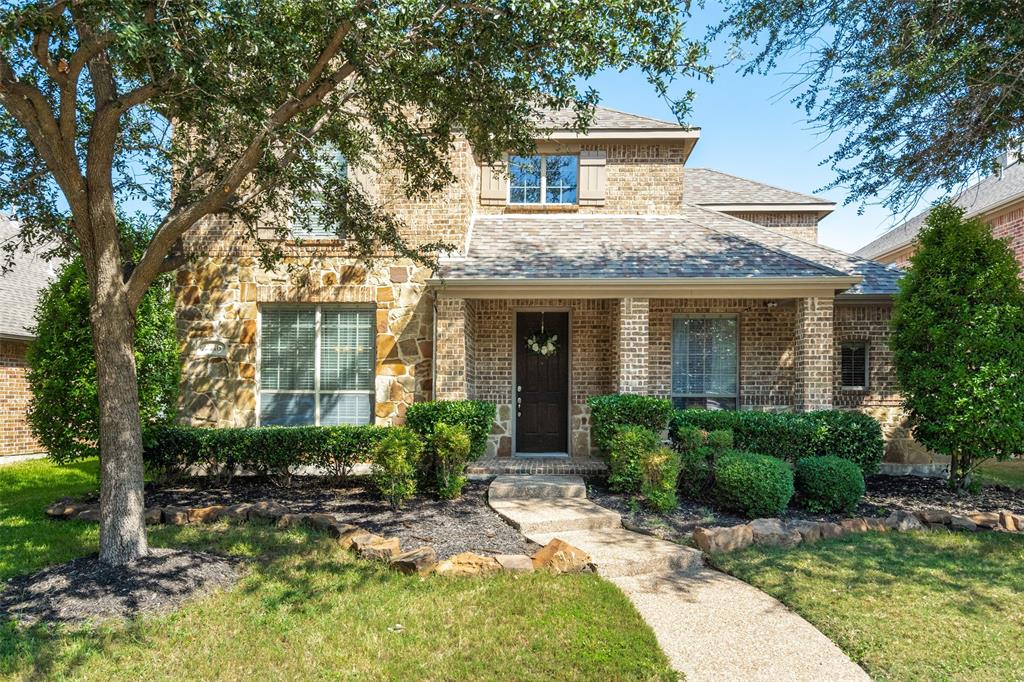 2116 Chambers Drive Allen, TX 75013 - Photo 1 of 1 a front view of a house with garden