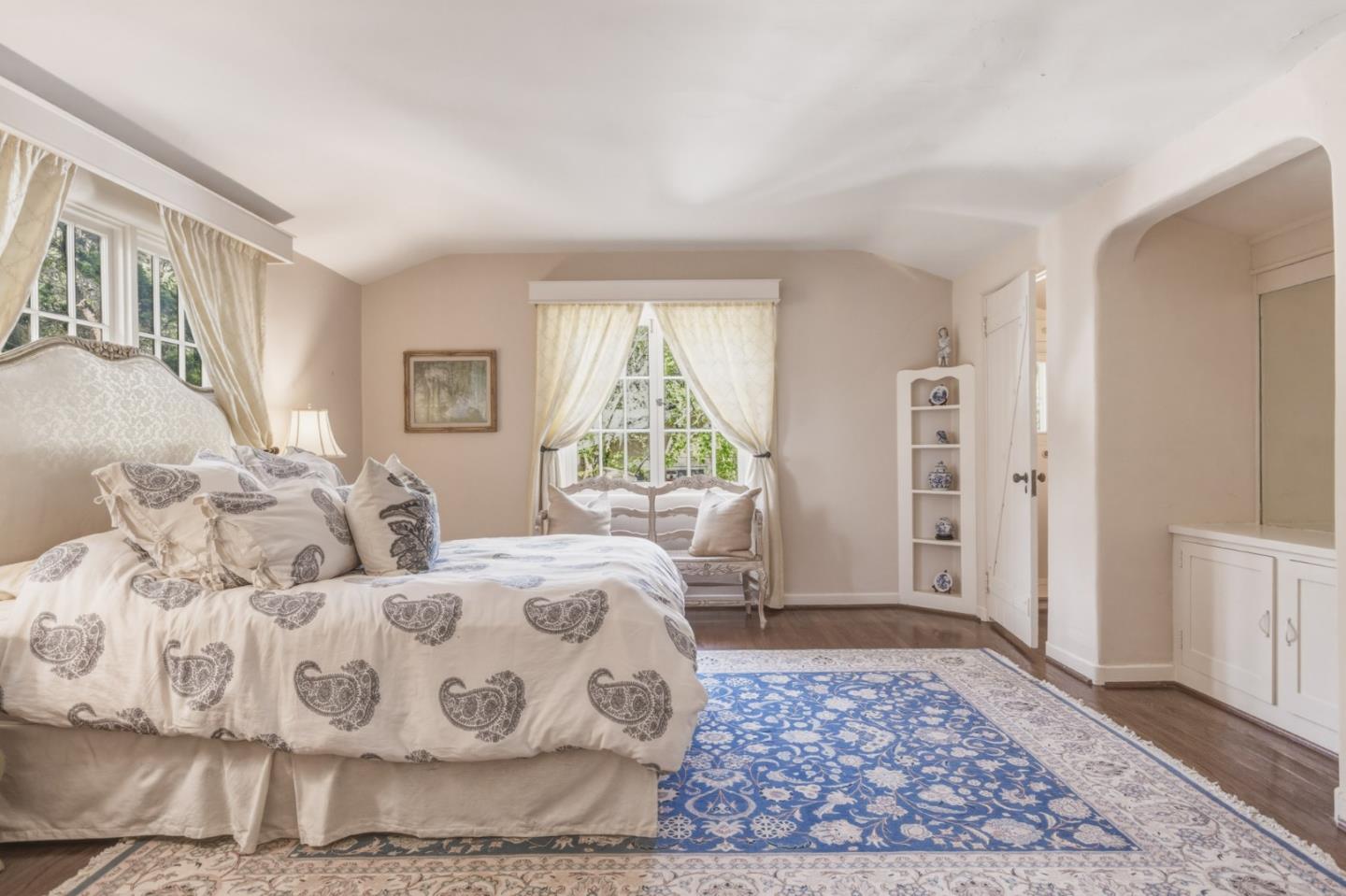 25286 Hatton Road Carmel, CA 93923 - Photo 25 of 34 a bedroom with a large bed rug and a window