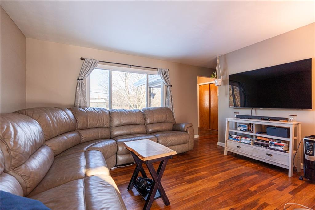 536 Butler Pike Mercer, PA 16137 - Photo 4 of 18 a living room with furniture and a flat screen tv