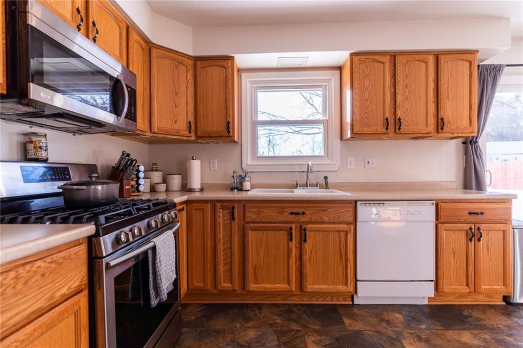 536 Butler Pike Mercer, PA 16137 - Photo 7 of 18 a kitchen with stainless steel appliances granite countertop a sink stove and microwave