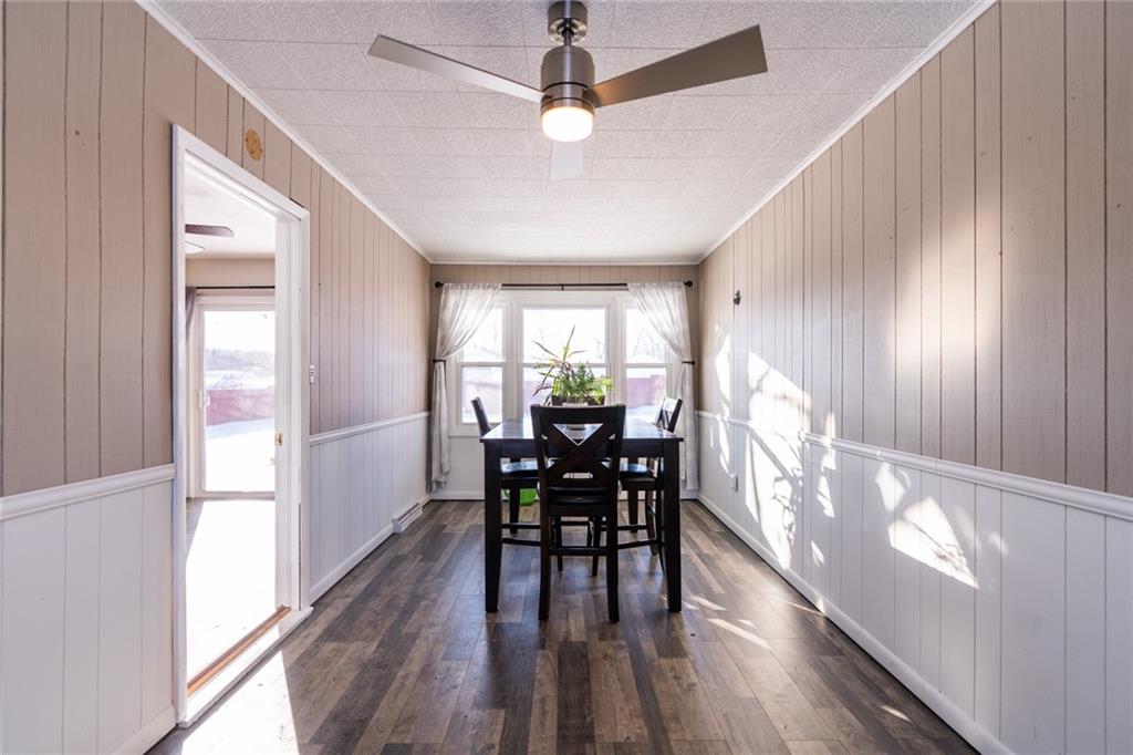 536 Butler Pike Mercer, PA 16137 - Photo 8 of 18 a view of a dining room with furniture window and wooden floor