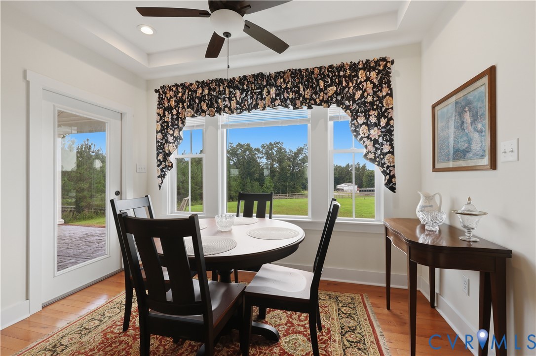 25181 West Soap Stone Road Jetersville, VA 23083 - Photo 15 of 54 Dining space featuring wood-finish flooring, a tra