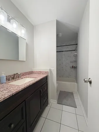 a bath room with a toilet and a shower