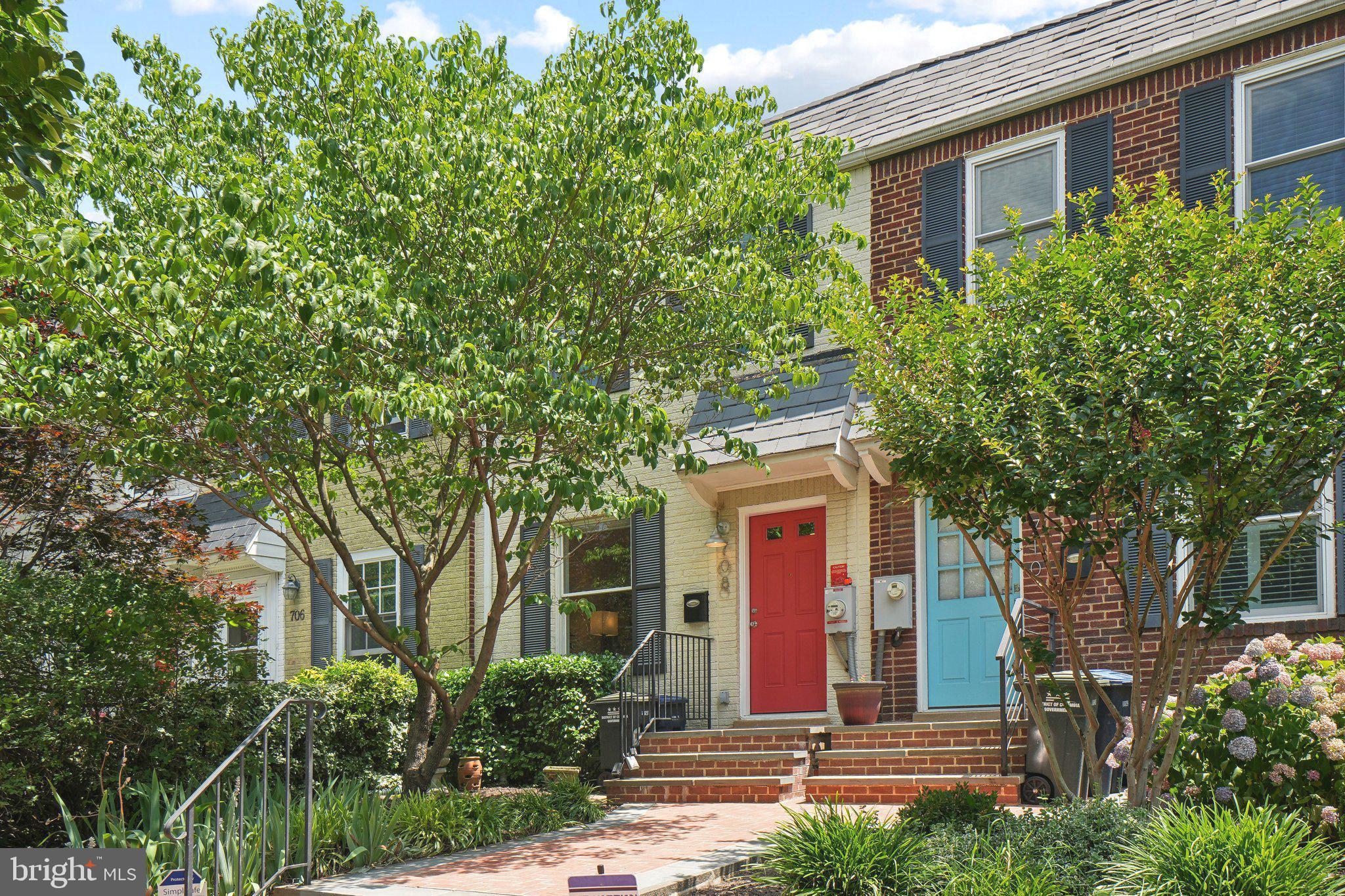 front view of a house with a tree