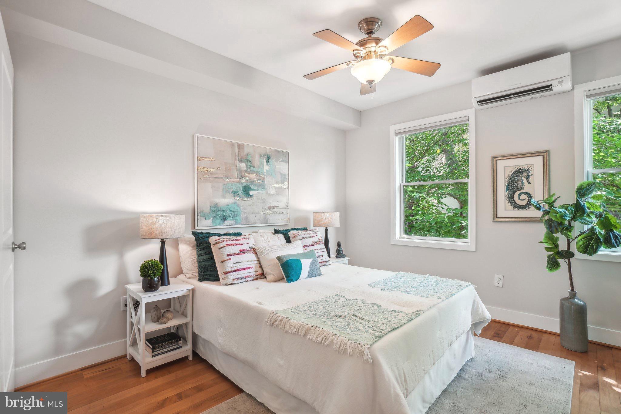 708 5th Street Southeast Washington, DC 20003 - Photo 16 of 25 a bedroom with a bed and a potted plant