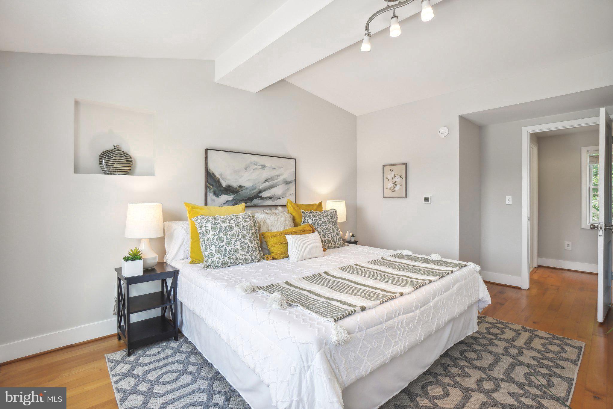 708 5th Street Southeast Washington, DC 20003 - Photo 21 of 25 a bedroom with a bed and wooden floor