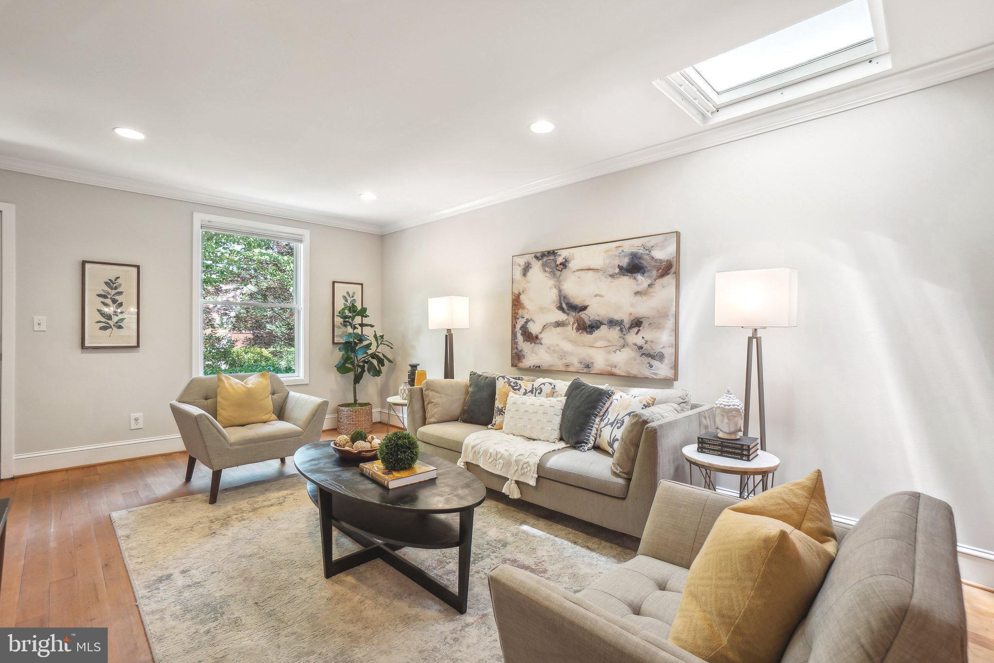 708 5th Street Southeast Washington, DC 20003 - Photo 3 of 25 a living room with furniture and a lamp