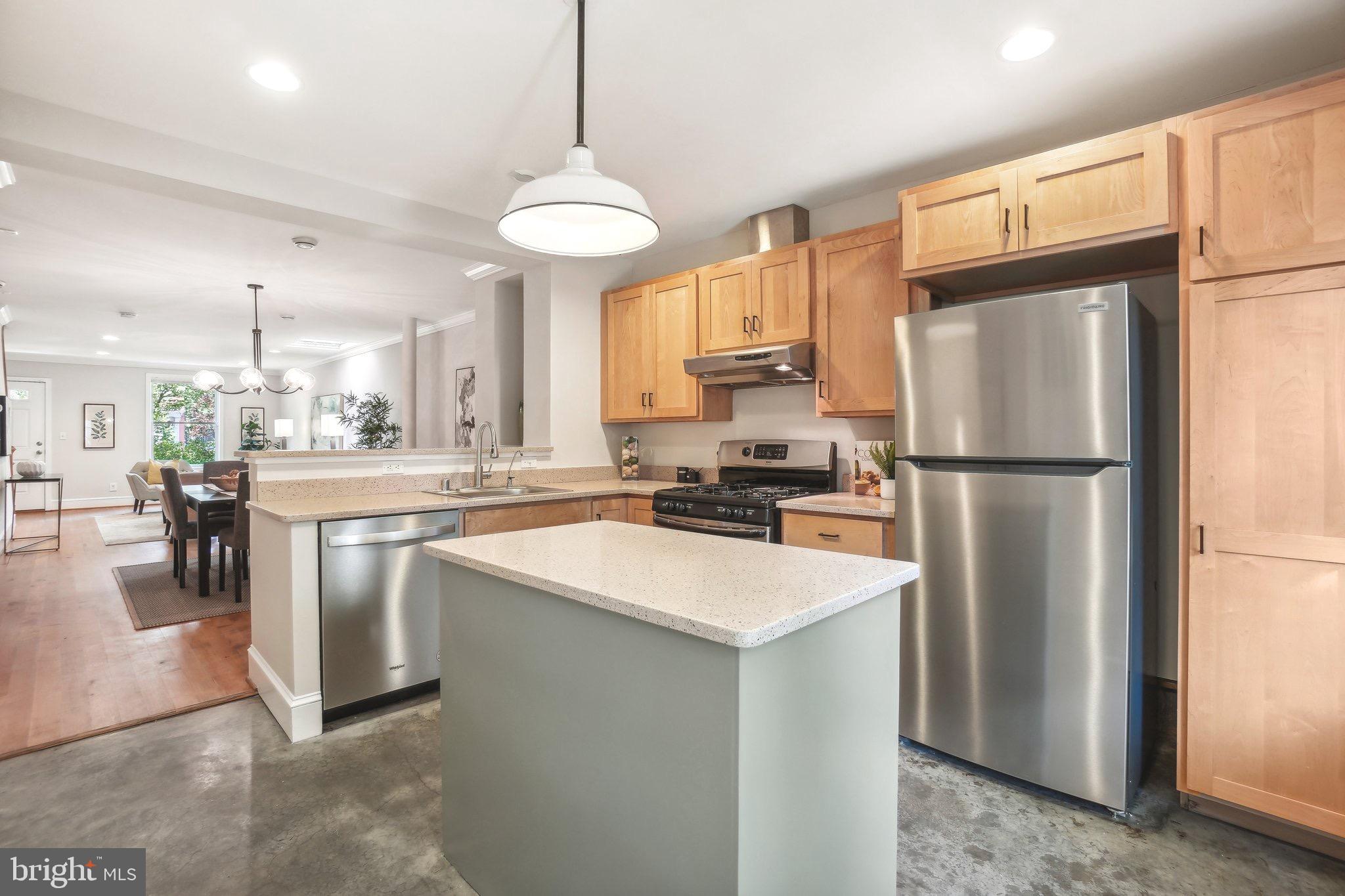 708 5th Street Southeast Washington, DC 20003 - Photo 6 of 25 a kitchen with stainless steel appliances granite countertop a refrigerator a stove a sink and a refrigerator