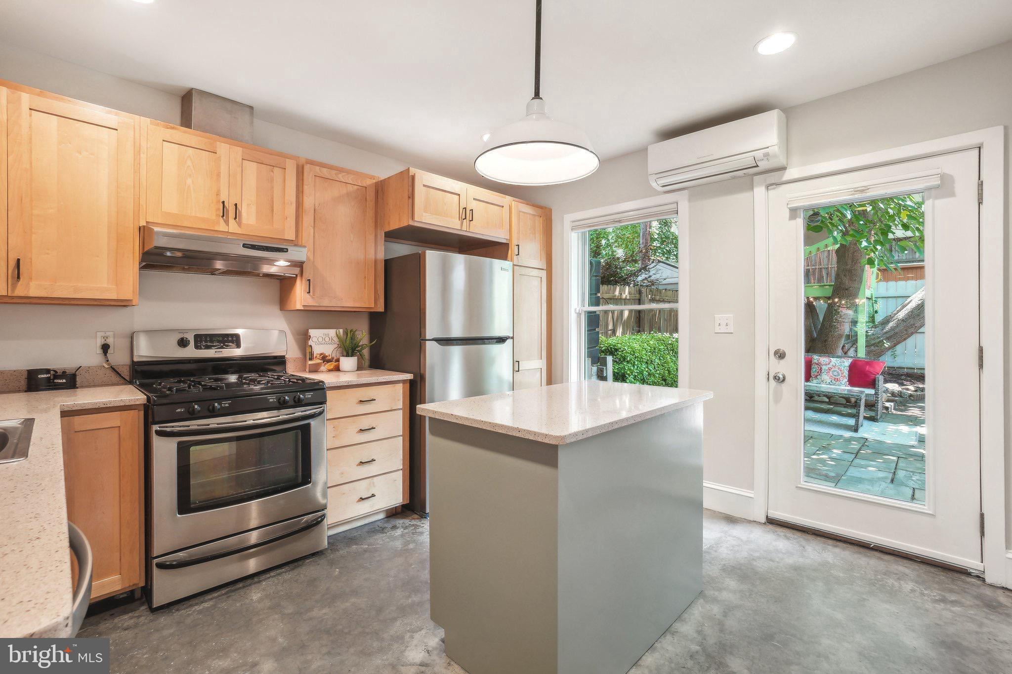 708 5th Street Southeast Washington, DC 20003 - Photo 7 of 25 a kitchen with stainless steel appliances a stove a refrigerator and a window