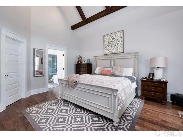 0 Firewater Julian, CA 92036 - Photo 11 of 16 a bed room with a bed a walk in closet and a lamp