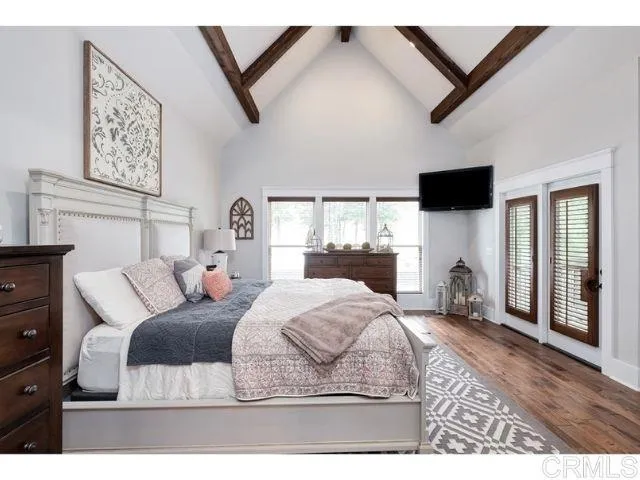 0 Firewater Julian, CA 92036 - Photo 12 of 16 a bedroom with a bed a flat screen tv and a large window