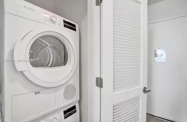 a view of a lake with palm trees