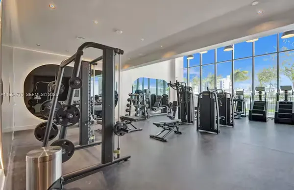 a spacious bathroom with a double vanity sink and a mirror