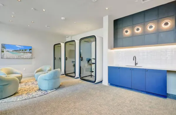 a living room with furniture flowerpot and a potted plant