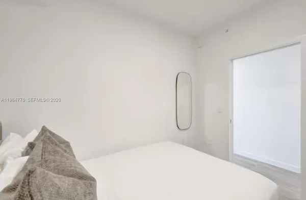 a bedroom with a bed and a table