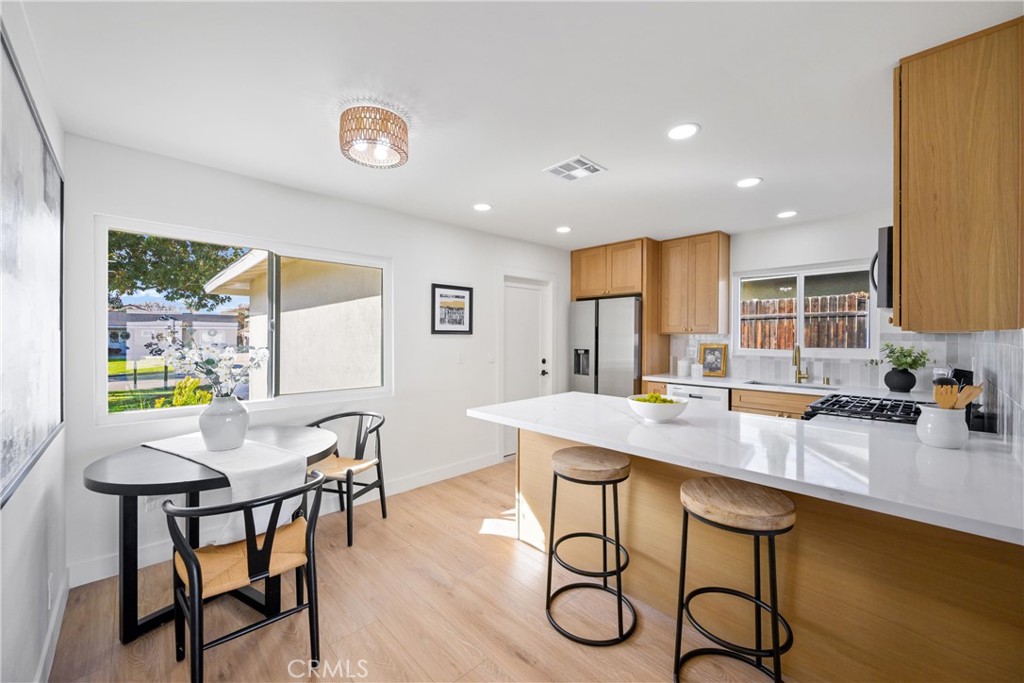 a kitchen with a table and chairs in it