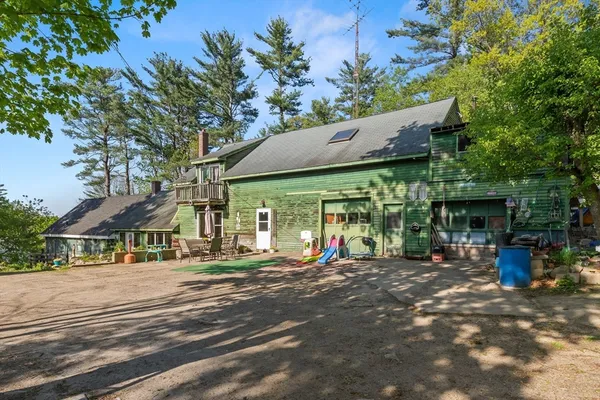 a view of a patio with table and chairs and potted plants