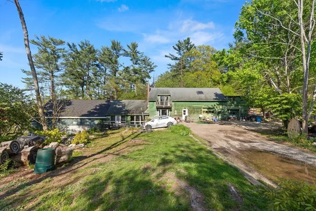 an aerial view of residential house with outdoor space