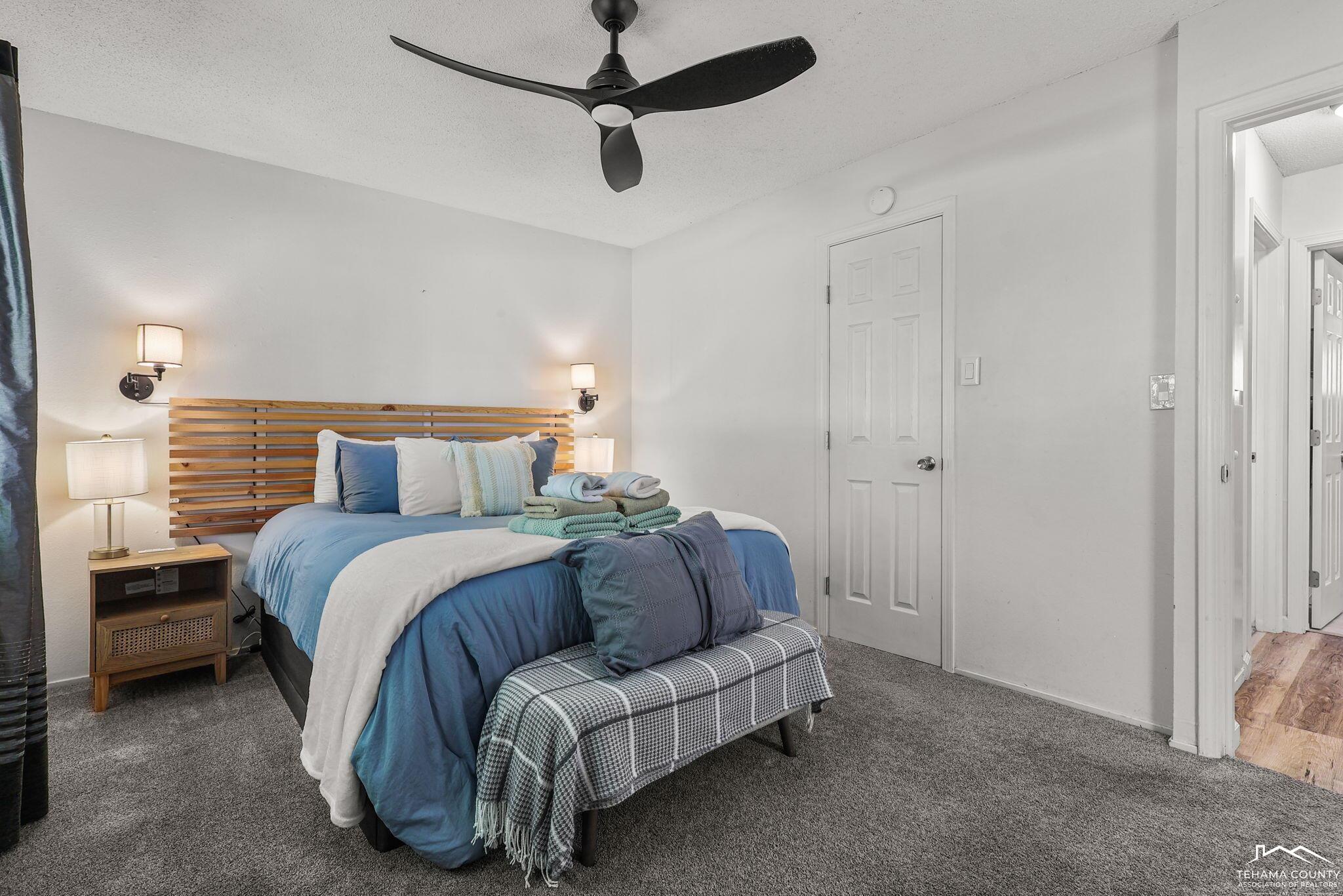 22275 Brent Road Red Bluff, CA 96080 - Photo 14 of 47 a spacious bedroom with a bed and a walk in closet