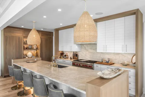 a kitchen with a sink stove and cabinets