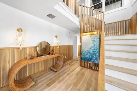 a view of a balcony with wooden floor