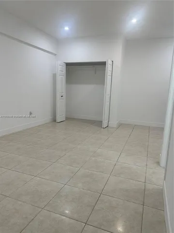 an empty room with a bathroom
