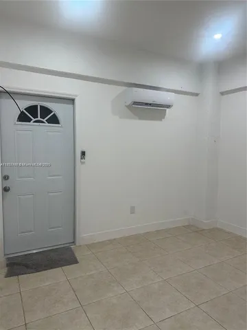 a view of a chair and table in the backyard