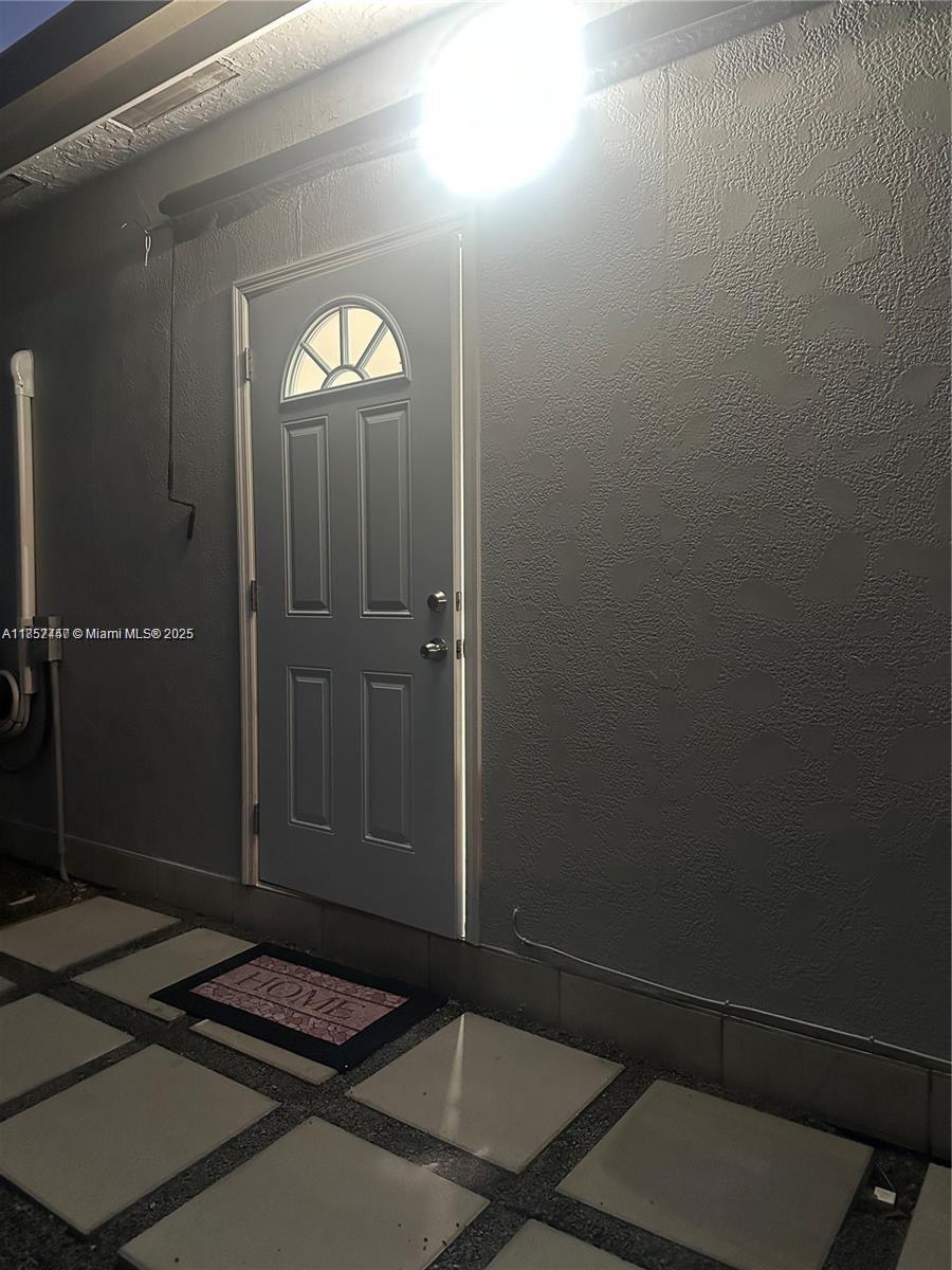 Eve Estates Homestead, FL 33033 - Photo 7 of 8 a bathroom with a mirror
