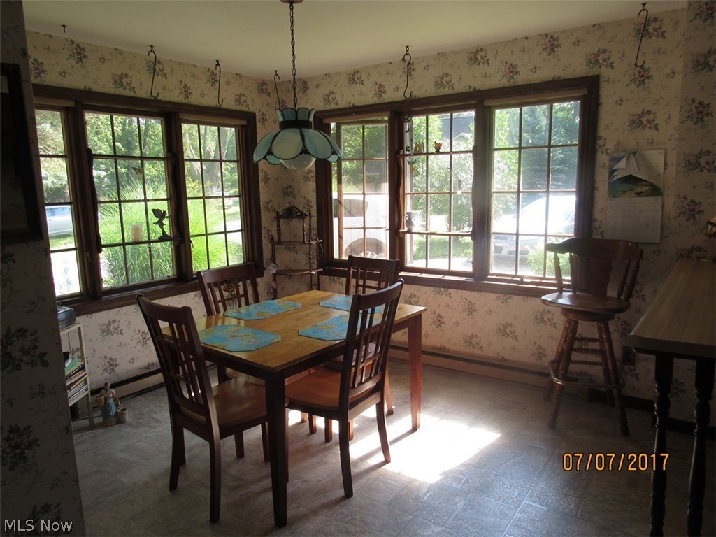 1664 Heather Road Madison, OH 44057 - Photo 3 of 32 Bright and cheery eat in kitchen. There's also a breakfast bar.