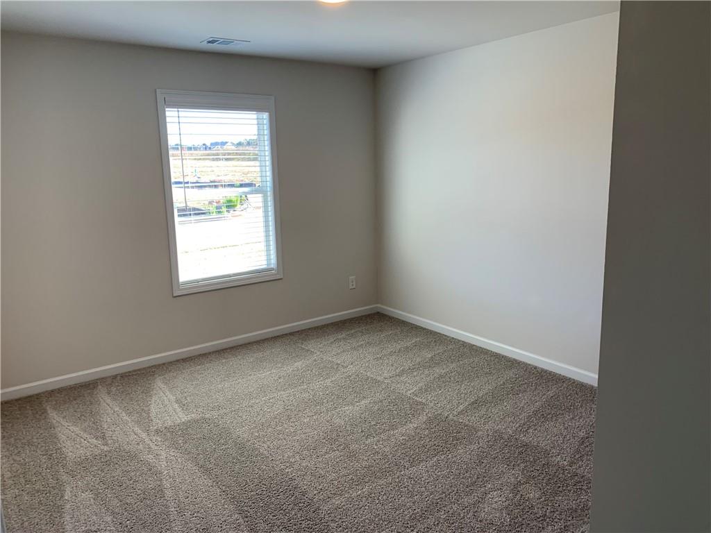 755 Rodeo Drive Auburn, GA 30011 - Photo 13 of 15 an empty room with a window