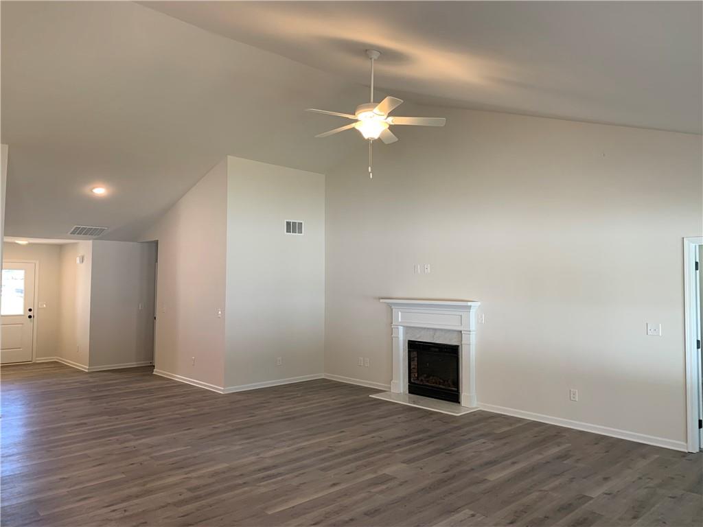 755 Rodeo Drive Auburn, GA 30011 - Photo 7 of 15 a view of empty room with wooden floor and fan