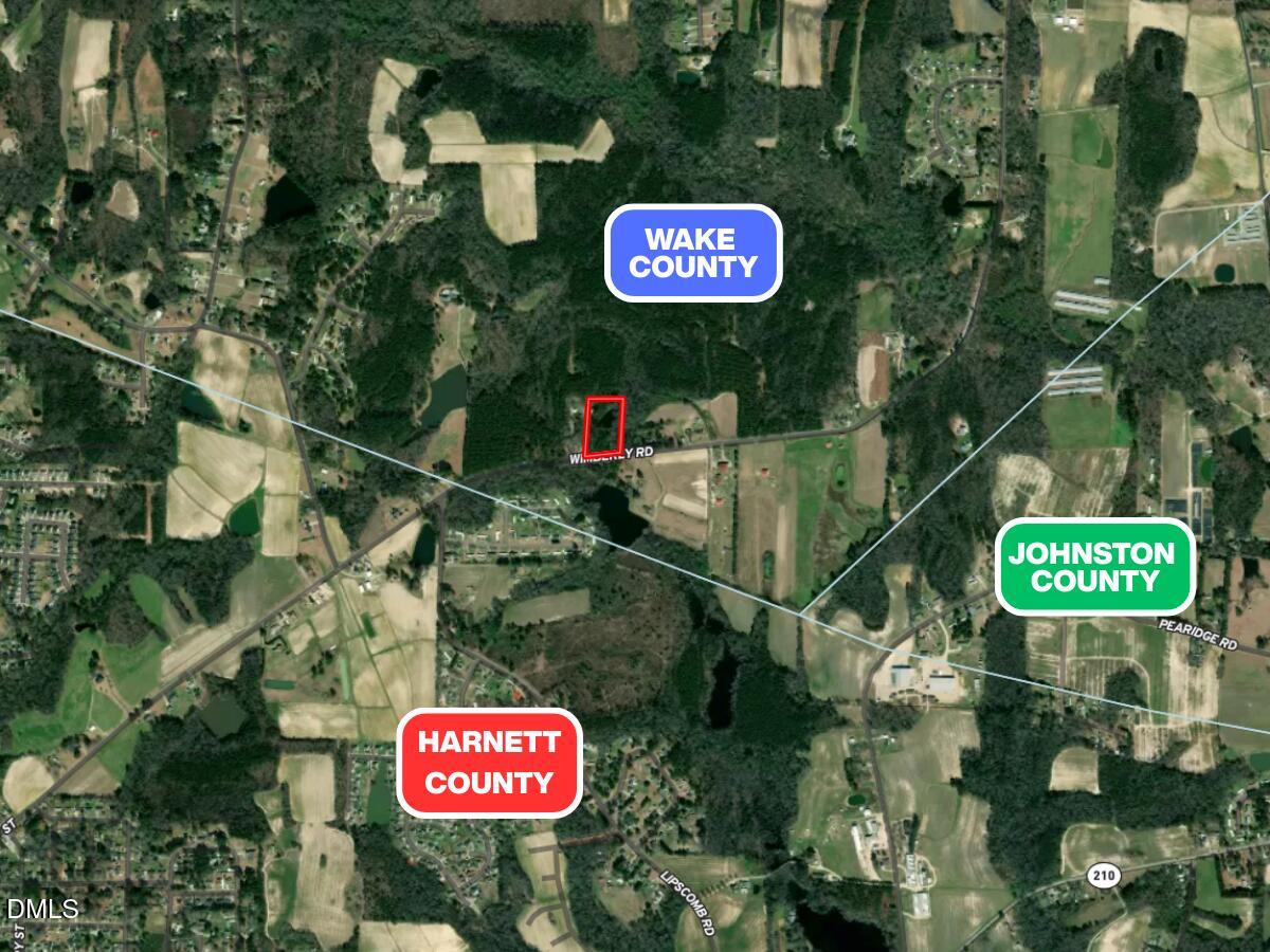 6724 Wimberly Road Willow Spring, NC 27592 - Photo 6 of 36 a sign that is on a pole