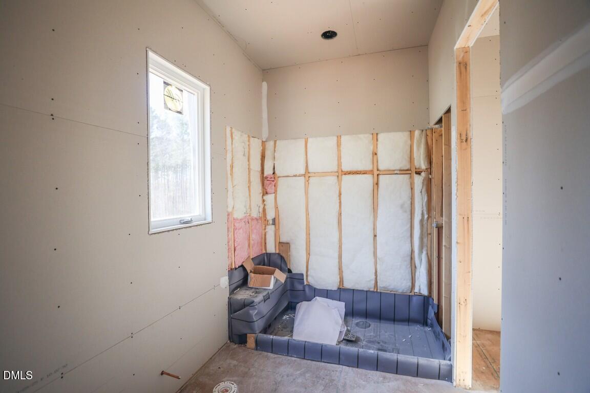 7429 Summer Tanager Trail Raleigh, NC 27614 - Photo 13 of 43 a living room with furniture and a large window
