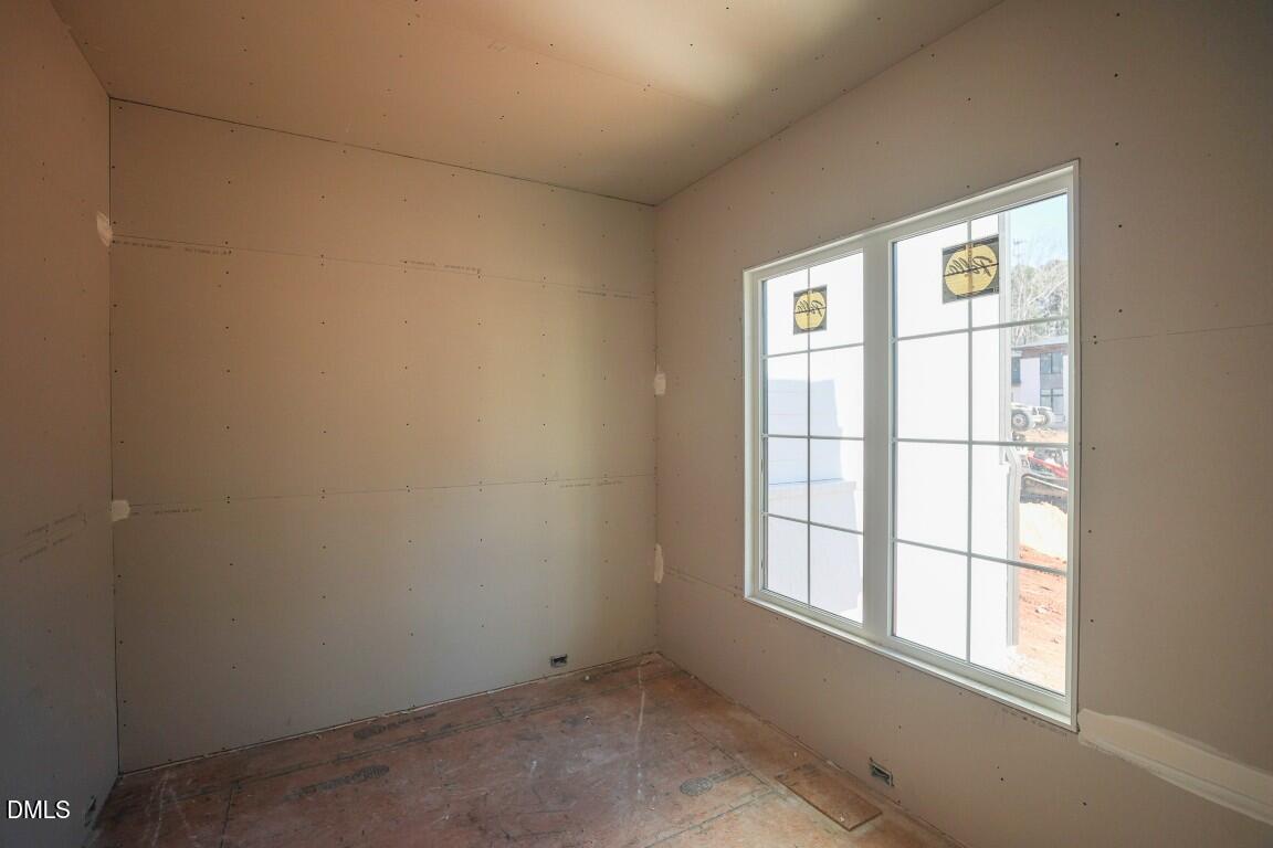 7429 Summer Tanager Trail Raleigh, NC 27614 - Photo 21 of 43 an empty room with a window