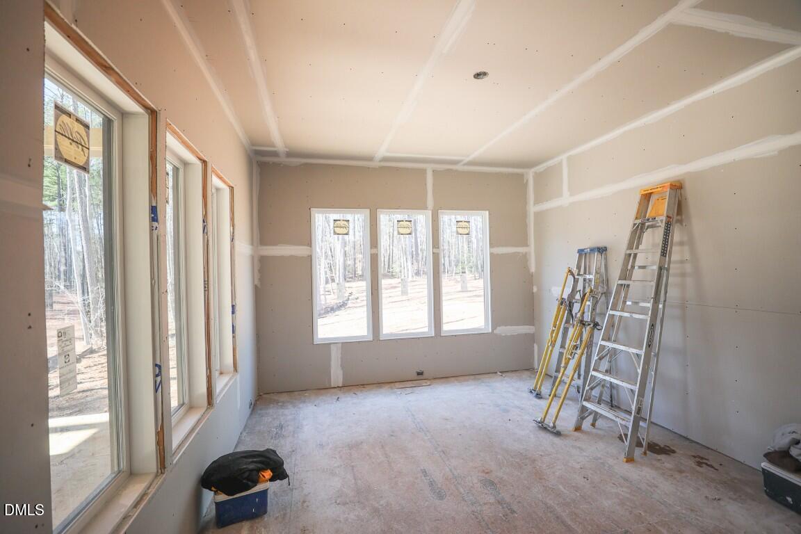 7429 Summer Tanager Trail Raleigh, NC 27614 - Photo 6 of 43 a view of an empty room with a window