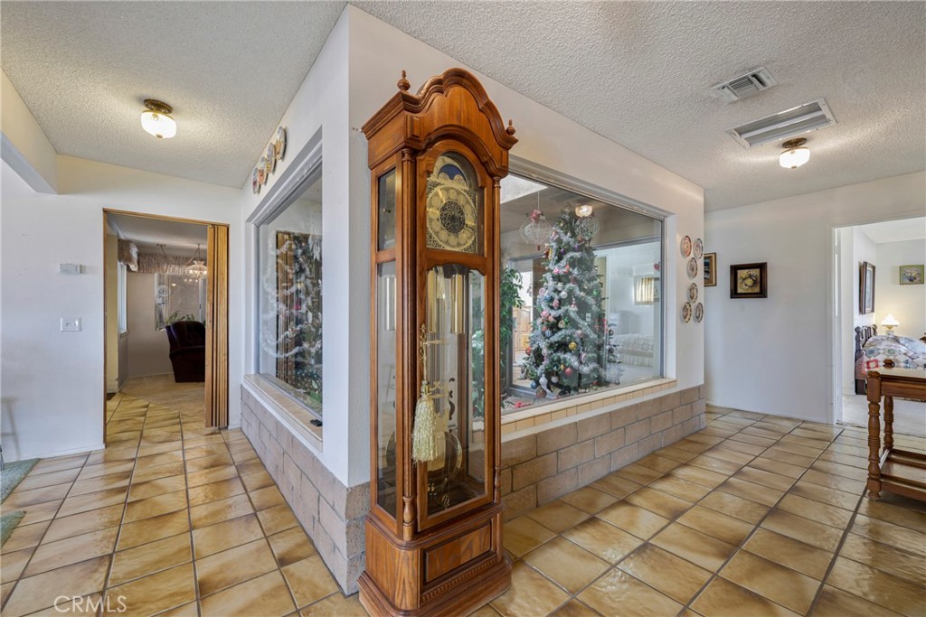 60383 Melton Trail Joshua Tree, CA 92252 - Photo 12 of 72 a view of a hallway view with wooden floor and staircase