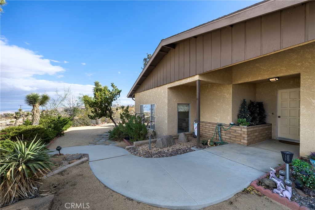 60383 Melton Trail Joshua Tree, CA 92252 - Photo 7 of 72 a view of a house with patio