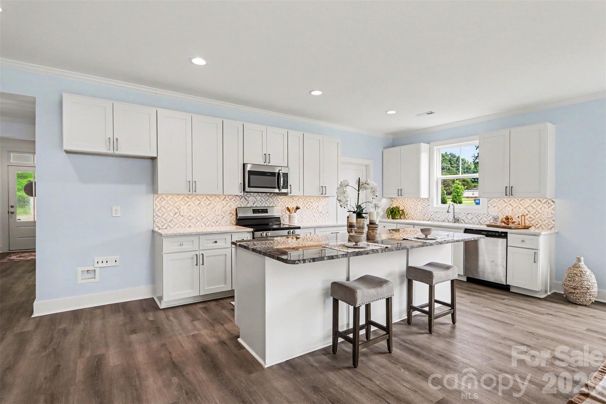 4115 Miller Road Salisbury, NC 28147 - Photo 6 of 26 a kitchen with white cabinets and white appliances