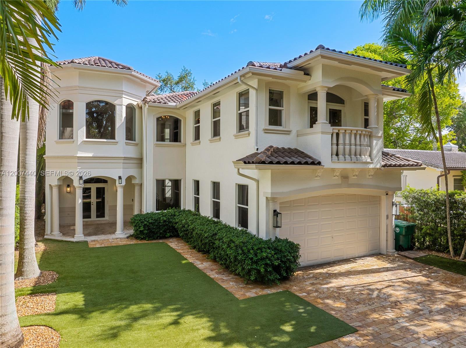 4065 Battersea Road Miami, FL 33133 - Photo 1 of 39 a front view of a house with a yard