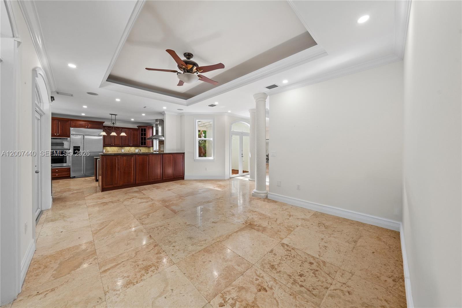 4065 Battersea Road Miami, FL 33133 - Photo 11 of 39 a view of a kitchen with a sink and a refrigerator