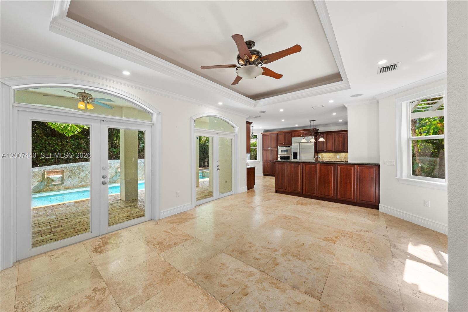 4065 Battersea Road Miami, FL 33133 - Photo 12 of 39 a view of an empty room with window and cabinet