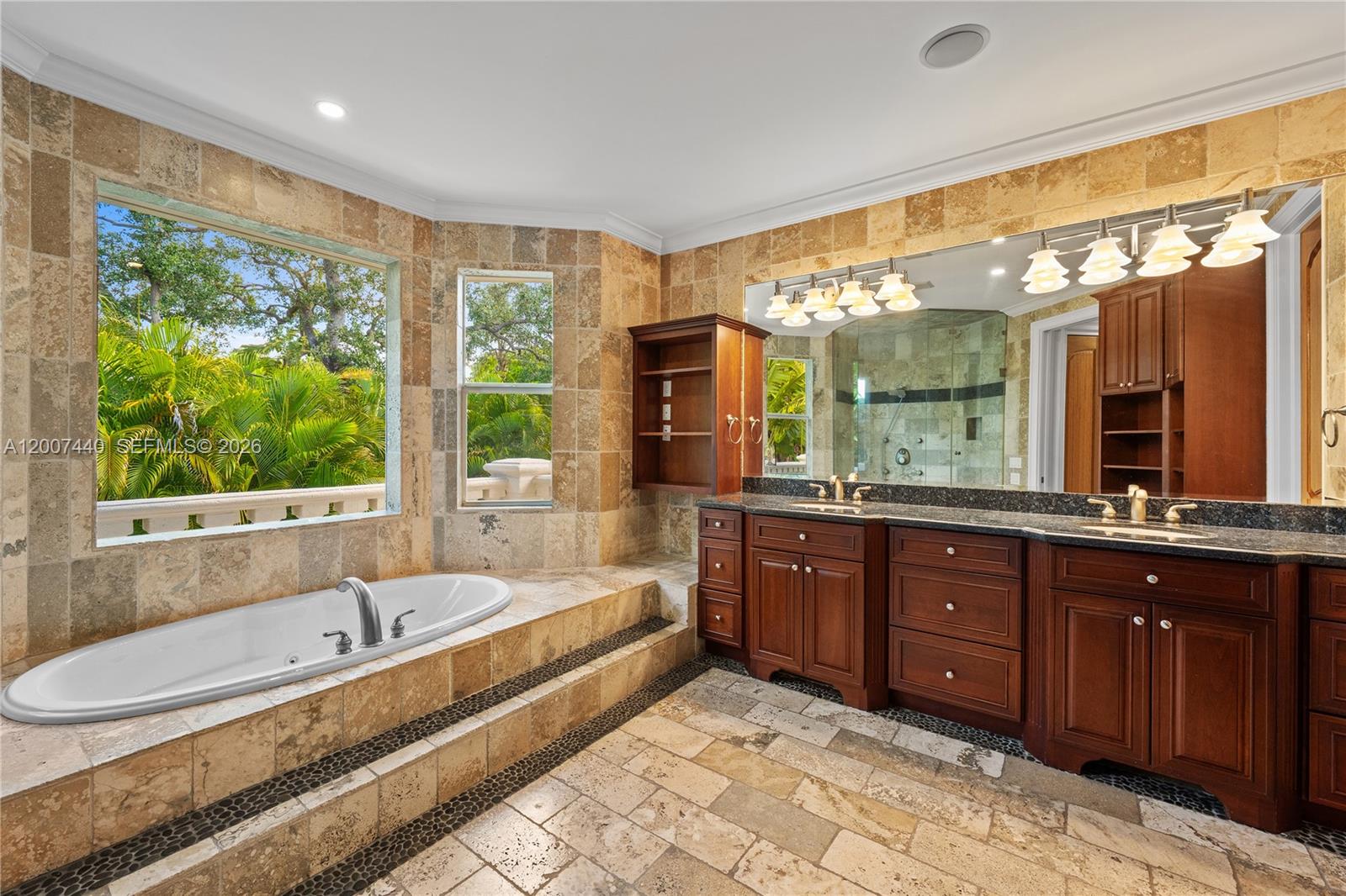 4065 Battersea Road Miami, FL 33133 - Photo 17 of 39 a large spacious bathroom with a large tub and sink