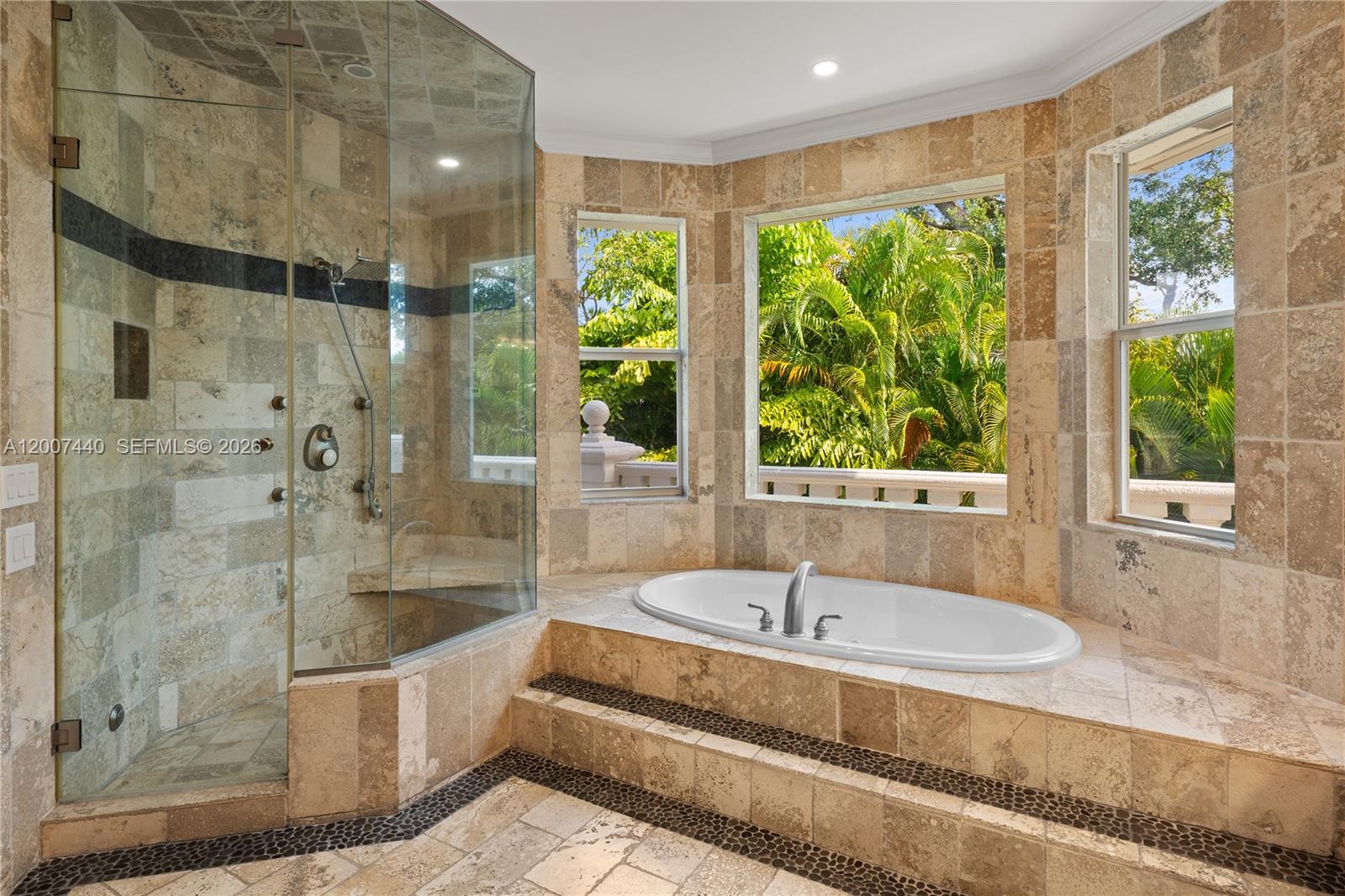 4065 Battersea Road Miami, FL 33133 - Photo 18 of 39 a bathroom with shower and a bathtub