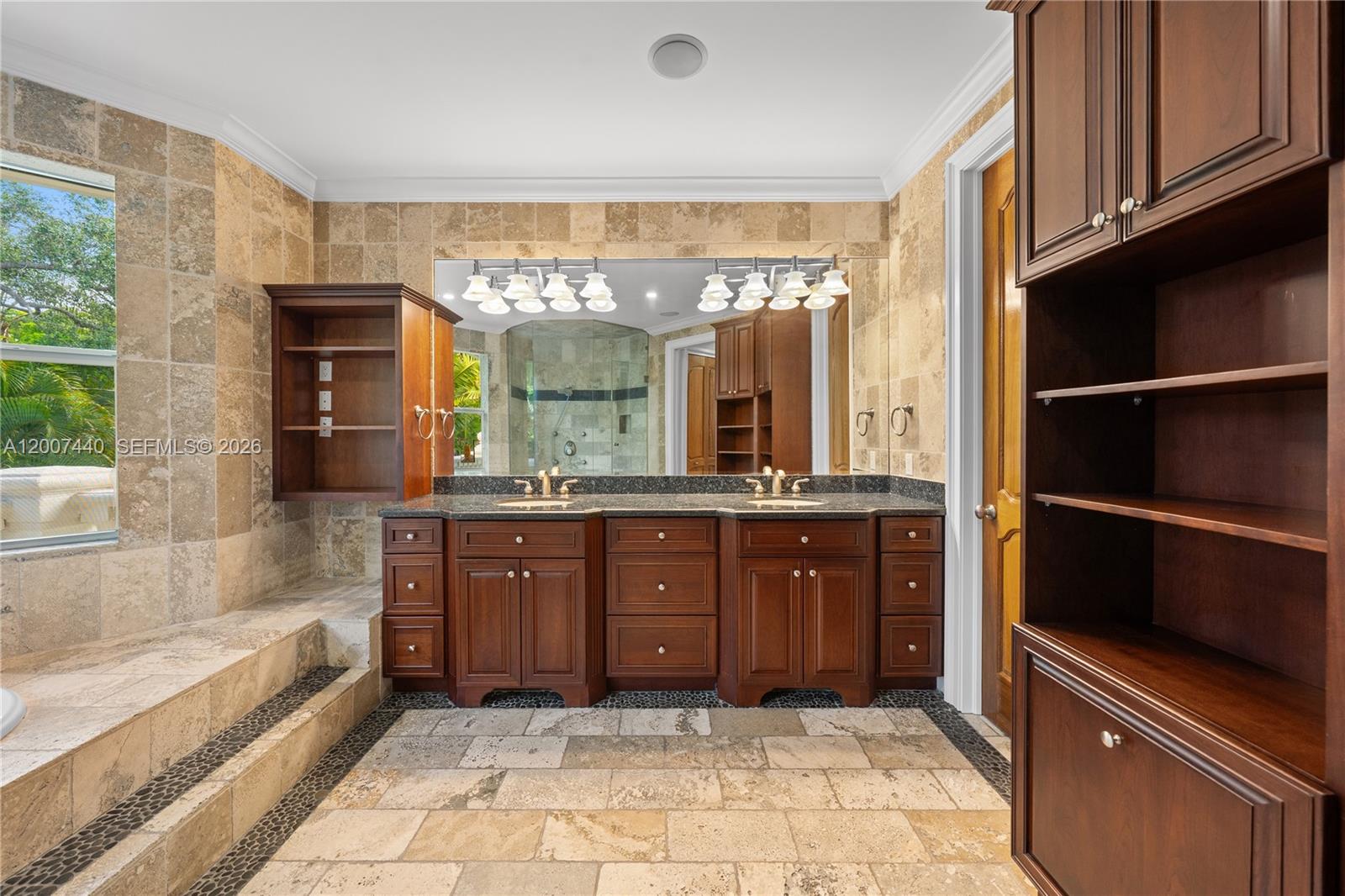 4065 Battersea Road Miami, FL 33133 - Photo 19 of 39 a bathroom with a sink a vanity and a bathtub