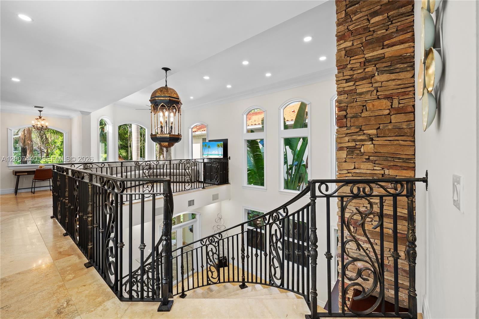 4065 Battersea Road Miami, FL 33133 - Photo 21 of 39 a view of a hallway with entryway windows wooden floor and front door
