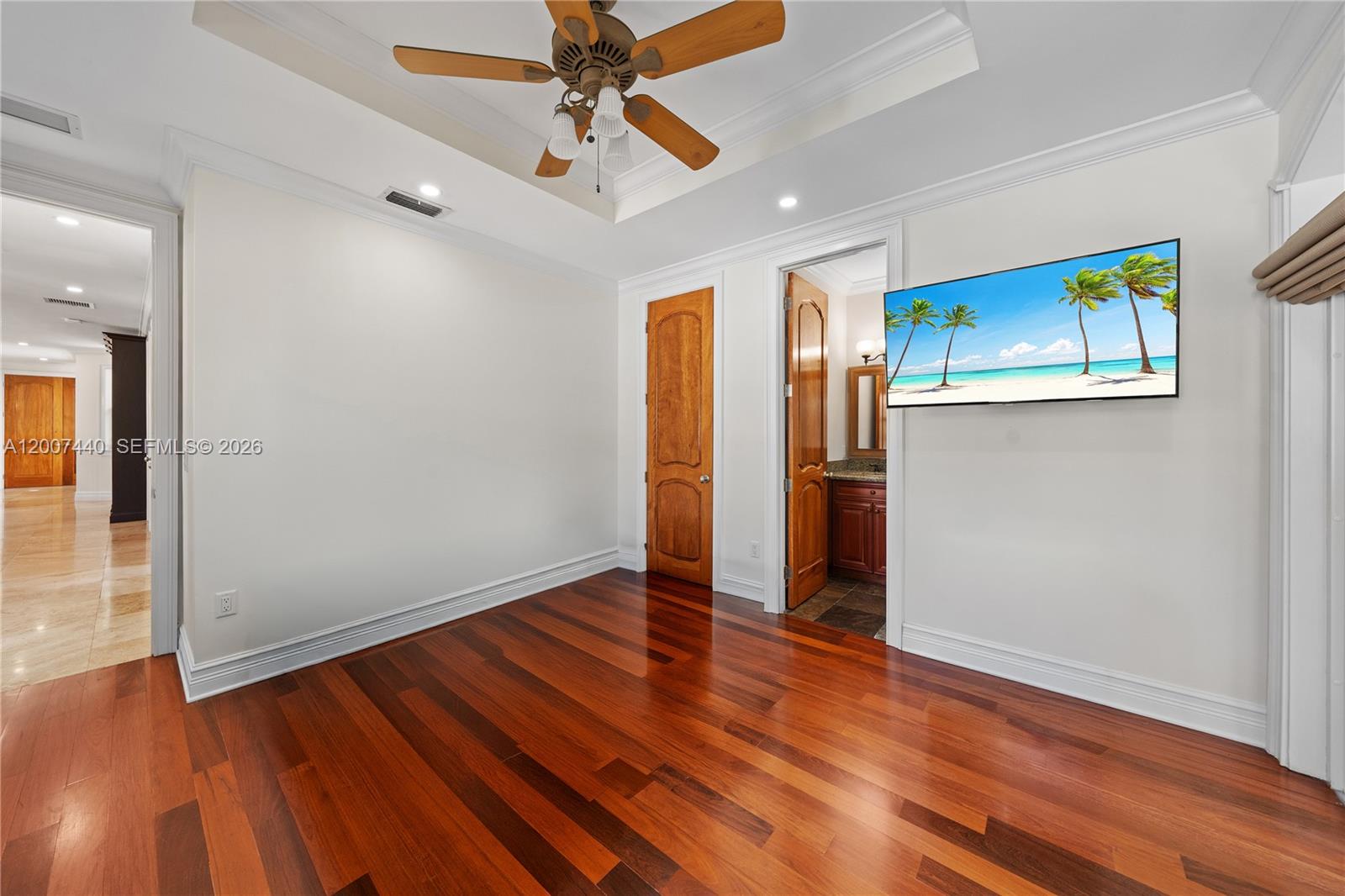 4065 Battersea Road Miami, FL 33133 - Photo 25 of 39 wooden floor in an empty room with a window