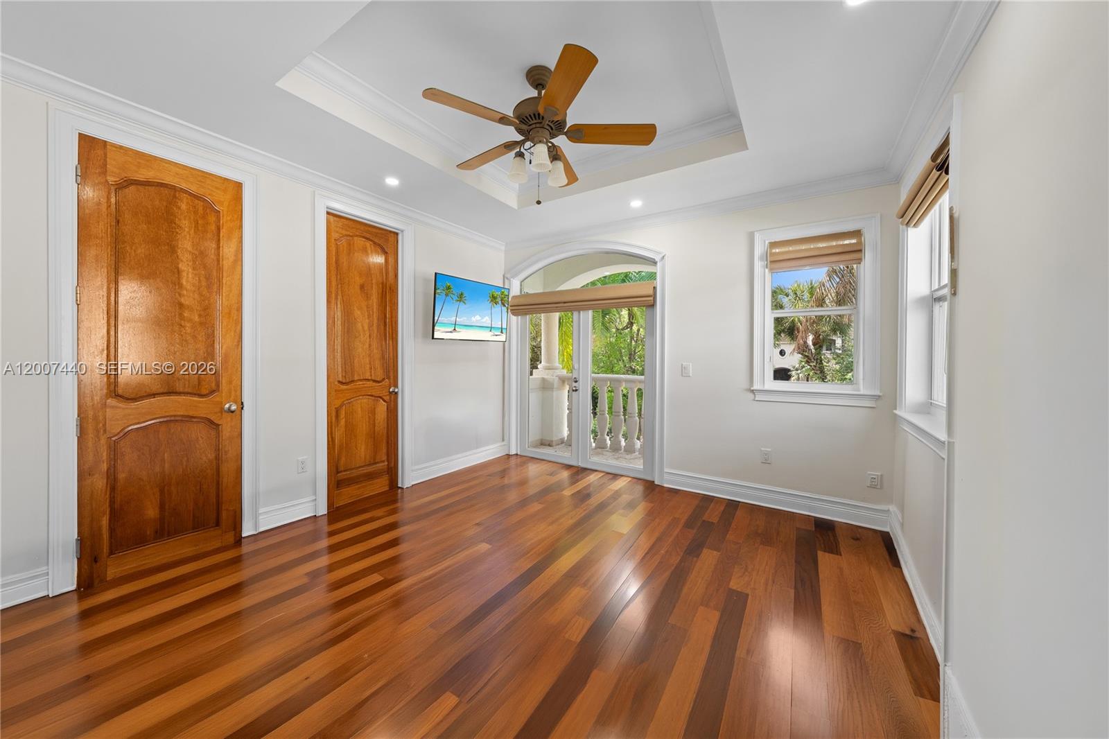4065 Battersea Road Miami, FL 33133 - Photo 27 of 39 a view of an empty room with a window and wooden floor
